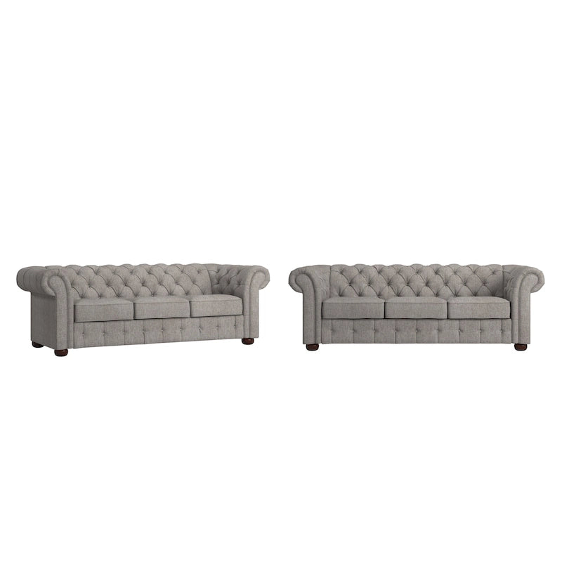Divano Chesterfield trapuntato con braccioli arrotolati