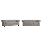 Divano Chesterfield trapuntato con braccioli arrotolati