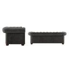 Divano Chesterfield trapuntato con braccioli arrotolati