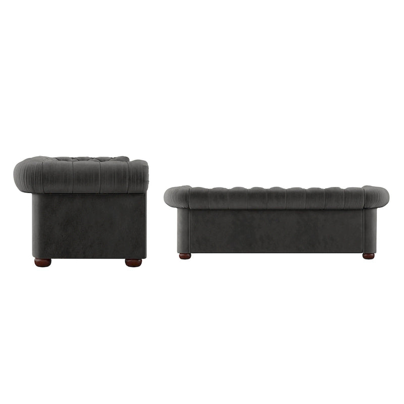 Divano Chesterfield trapuntato con braccioli arrotolati