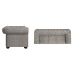 Divano Chesterfield trapuntato con braccioli arrotolati