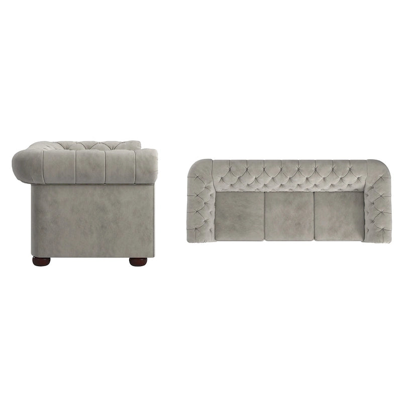 Divano Chesterfield trapuntato con braccioli arrotolati