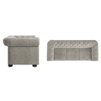Divano Chesterfield trapuntato con braccioli arrotolati