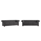 Divano Chesterfield trapuntato con braccioli arrotolati