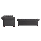 Divano Chesterfield trapuntato con braccioli arrotolati